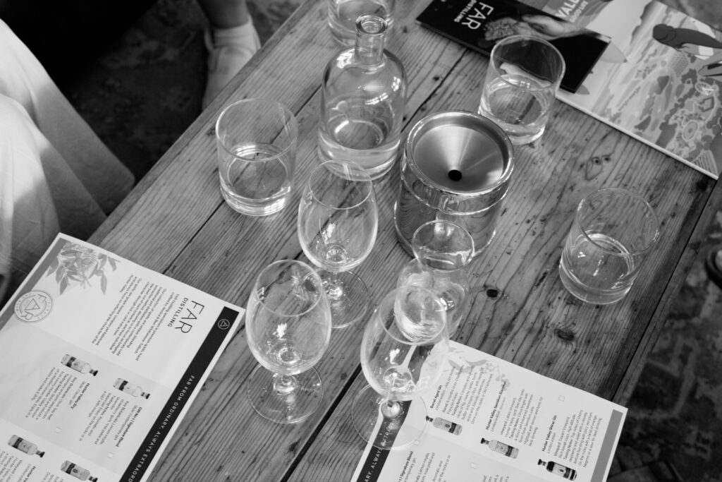 Tasting glasses, carafe and printed tasting notes at the FAR Distilling tasting room inside the Keith Tulloch Wine cellar door, Pokolbin